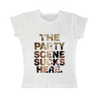 The Party Scene Sucks Here baby tee